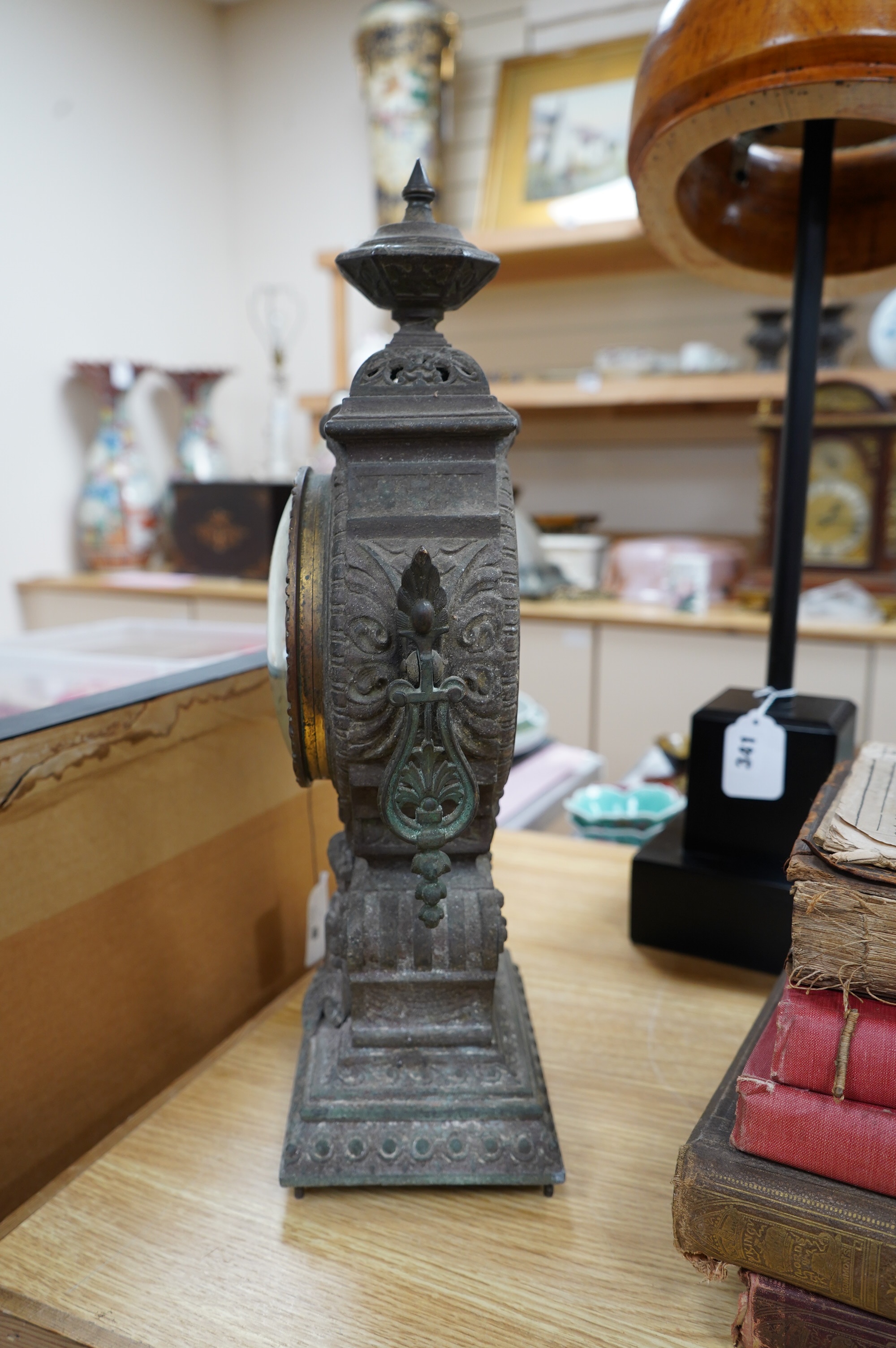 A spelter clock with enamel Arabic dial, 47cm high. Condition - poor to fair, untested